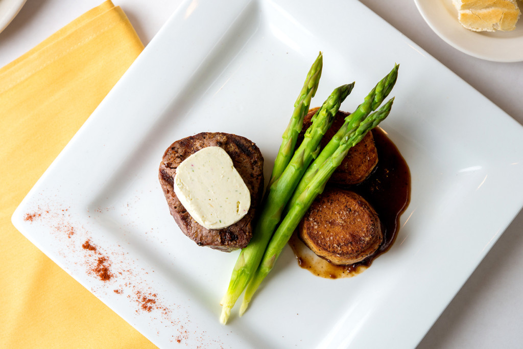 Steak Special with Potatoes Fondant, asparagus, and horseradish and shallot compound butter.