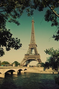 Eiffel Tower and bridge on Seine river in Paris, France. Vintage