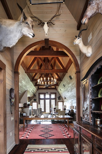 Stained pine walls in the loft provide a more refined take on the typical camp backdrop for bow-hunting prizes including impala, kudu, tsessebe, nilgai, sable, eland and elk.