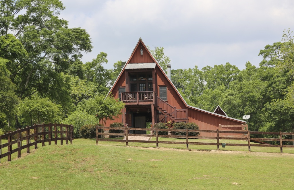 The barn, built in a modified A-frame style, easily accommodates both its practical farm functions and its more recently added leisure space.