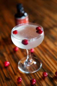 White cranberry juice gives a tart kick to the Christmas Cosmopolitan.