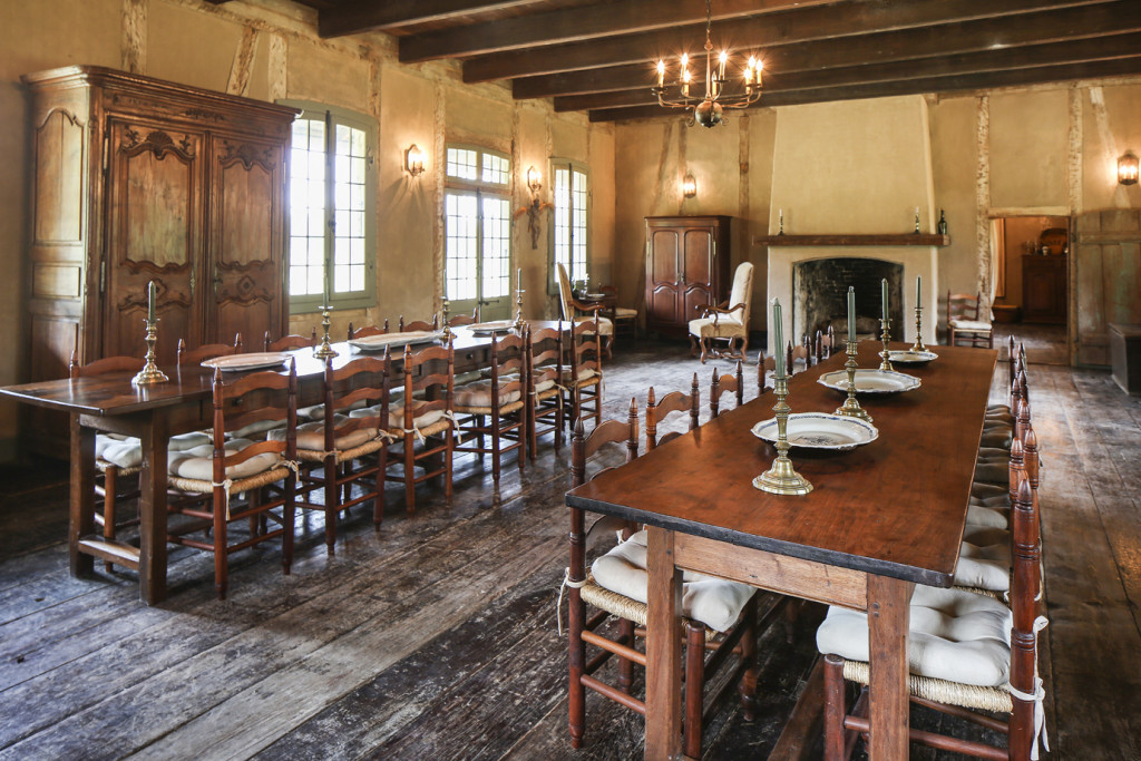 The salle, or dining room, in the LaCour House holds long tables that were once in the Ursuline Convent in New Orleans. The Holdens now use this space to host holiday dinners with extended family members.
