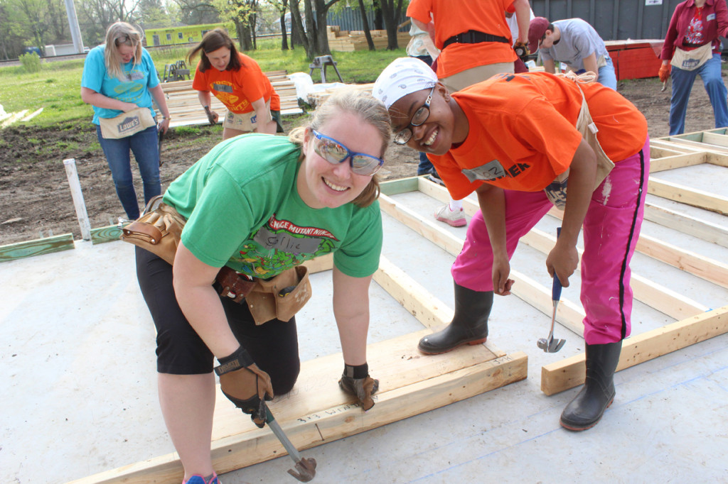 During an Albemarle Youth Build, Rachael Sollie (left) and homeowner-partner Jasmine Henderson work on a home. Image courtesy Habitat for Humanity