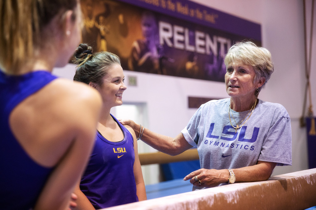 LSU gymnastics head coach D-D Breaux talks to some of her gymnasts.