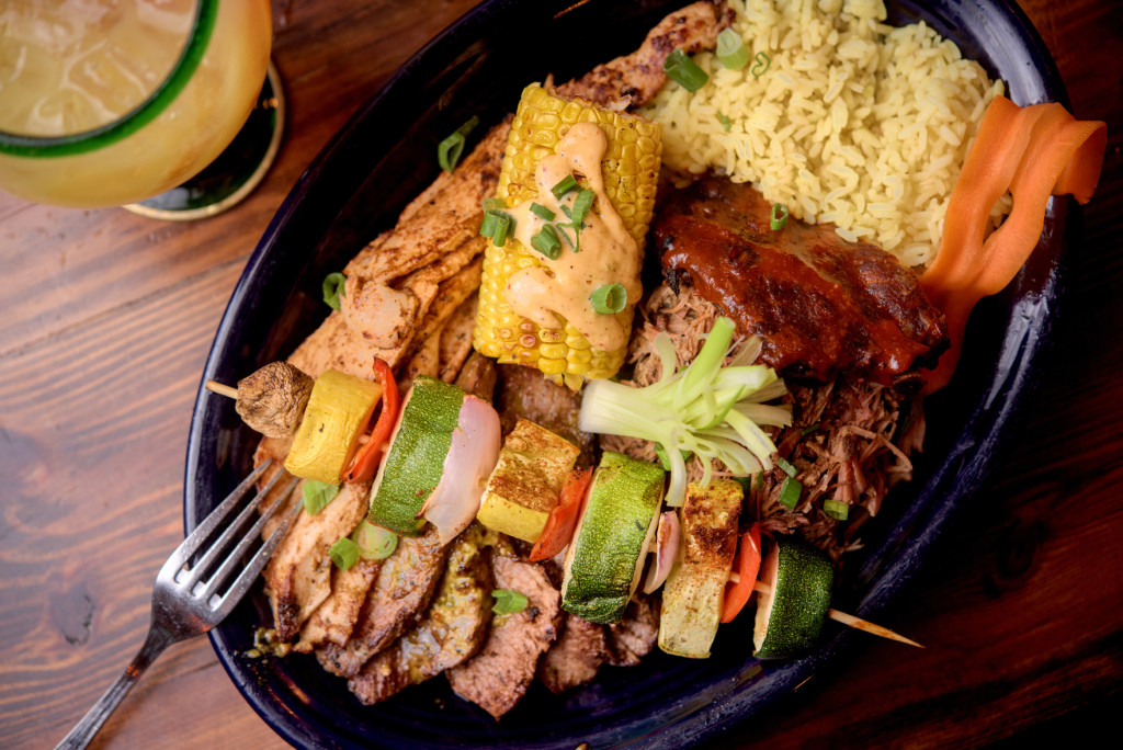 The hefty Mixed Grill features well-seasoned portions of pulled pork, fajita steak, pork ribs and fajita chicken, along with a veggie kabob and several sides.