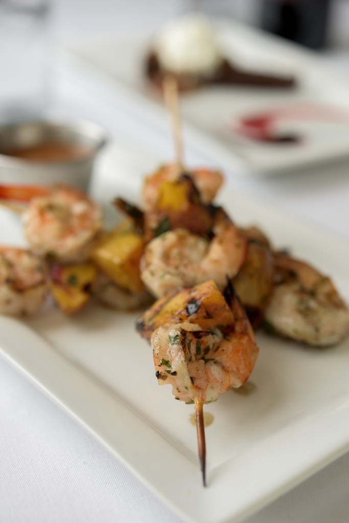 The Shrimp Spedeini appetizer includes skewers of shrimp with peaches and a homemade cocktail sauce.