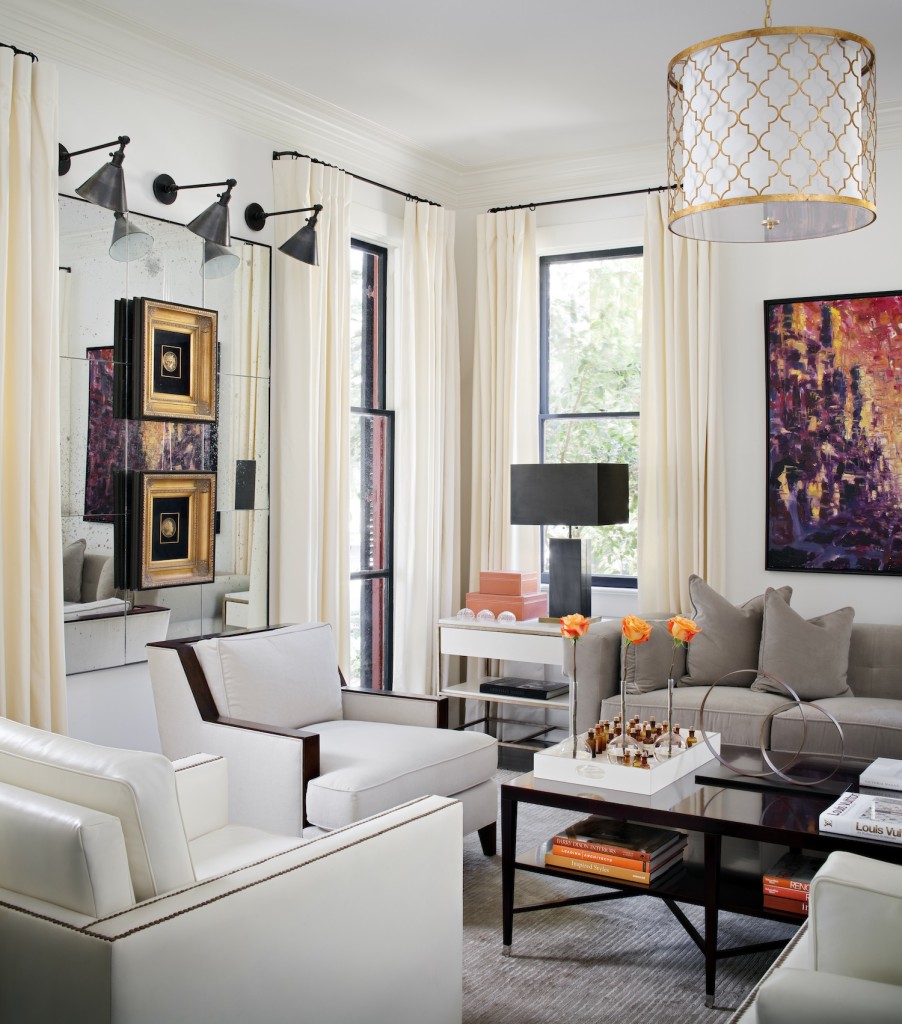 This living room embodies the “elegant modern” vibe Cheryl McCormick and her husband Derrell Cohoon wanted for their Spanish Town home. Seating in varied textures, including a velvet sofa and pairs of chairs in linen and leather, is part of a pale palette that brings the couple’s art collection to the forefront. Louisiana artist Alex Harvie created the painting over the sofa. Photo by Chipper Hatter.
