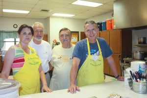 A group of volunteers inside the kitchen at the church. 