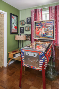 The pinball machine, which was inspired by The Who’s Tommy, was a New Orleans find. After being refurbished by Jeff, it now sits in a corner of the living room ready to play. Photo by Melissa Oivanki.