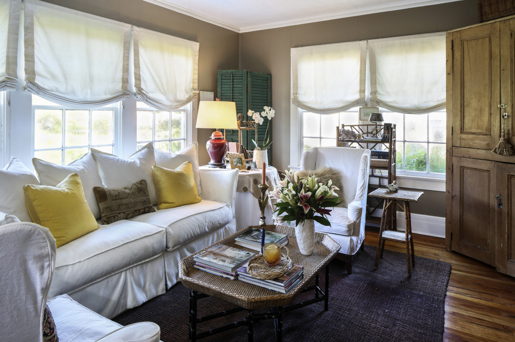 An oversized sofa and wingback chairs anchor the living room and invite guests to sit and linger. “This space is a comfortable place to entertain,” says Ruthie. “Nothing is too precious. I don’t care if people put their feet up on the coffee table.”